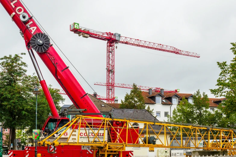 a crane is lifting a large building on a crane