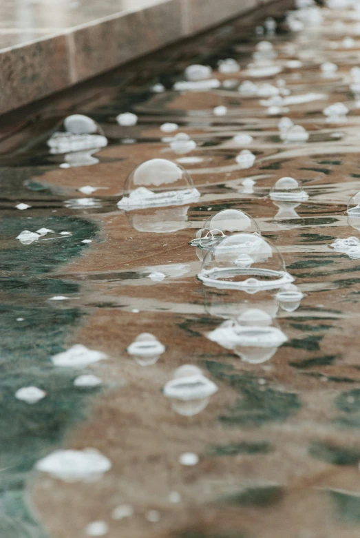 some water drops and a street light next to it