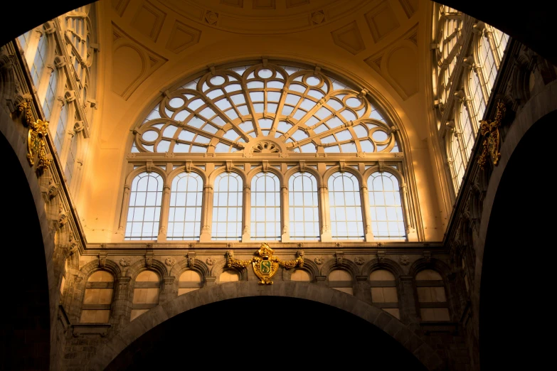 the arched windows in this building are shining brightly