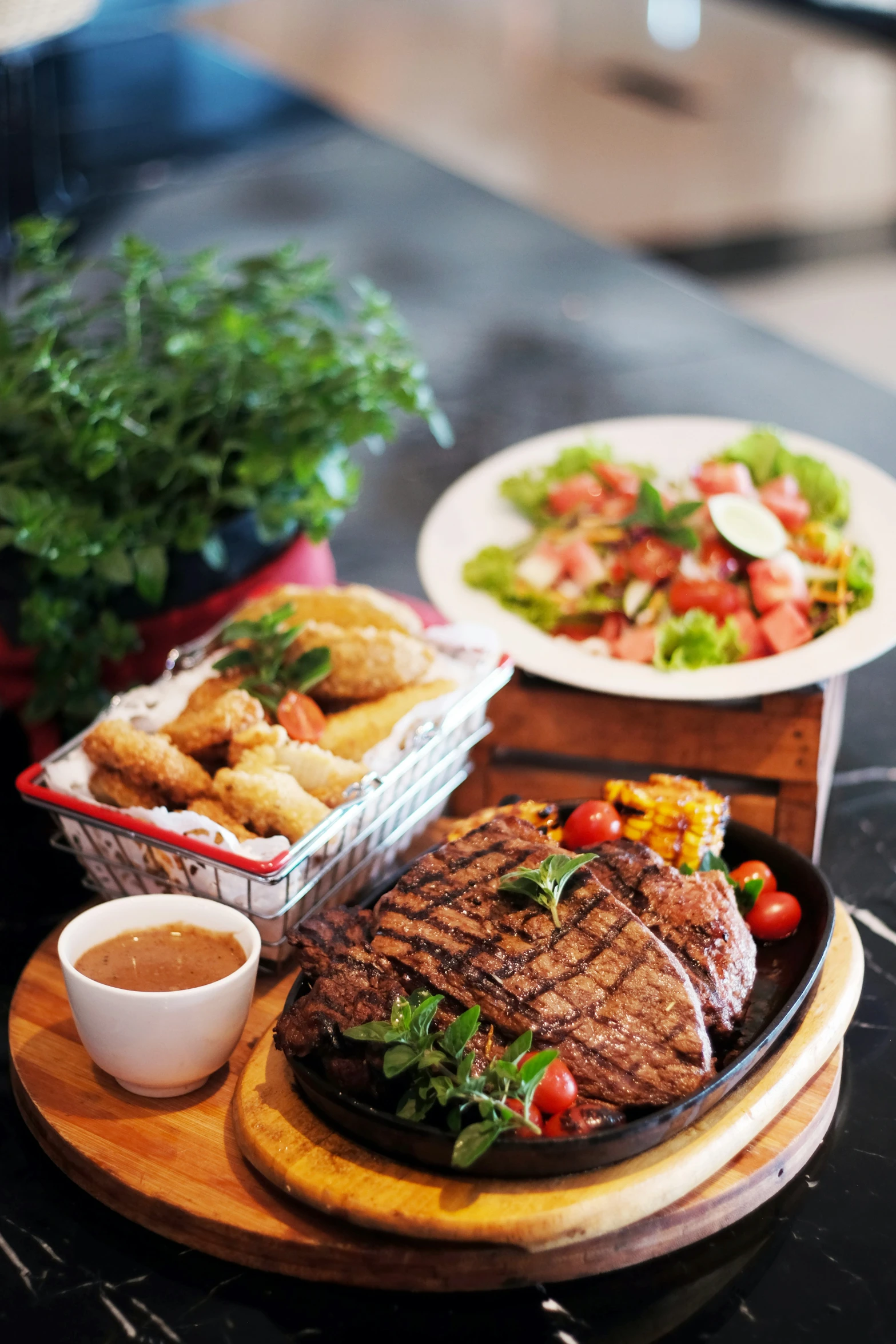 a grilled steak sits on a plate next to a plate of fries