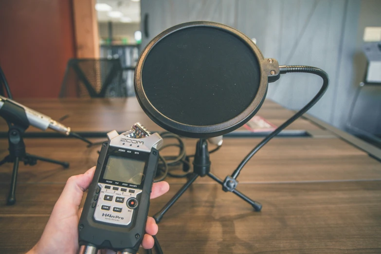 a microphone with a hand held a radio receiver