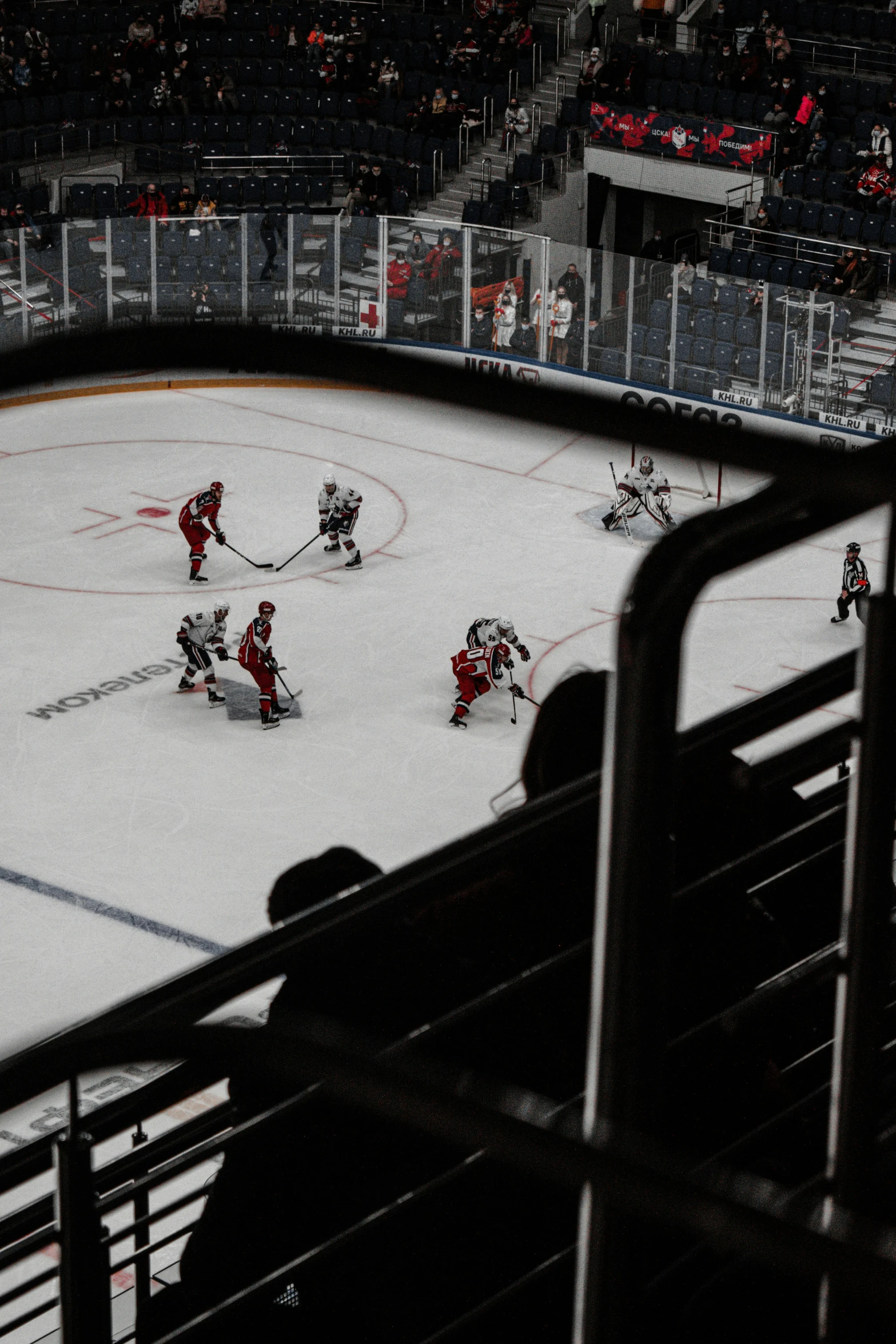 a hockey game being played on a rink