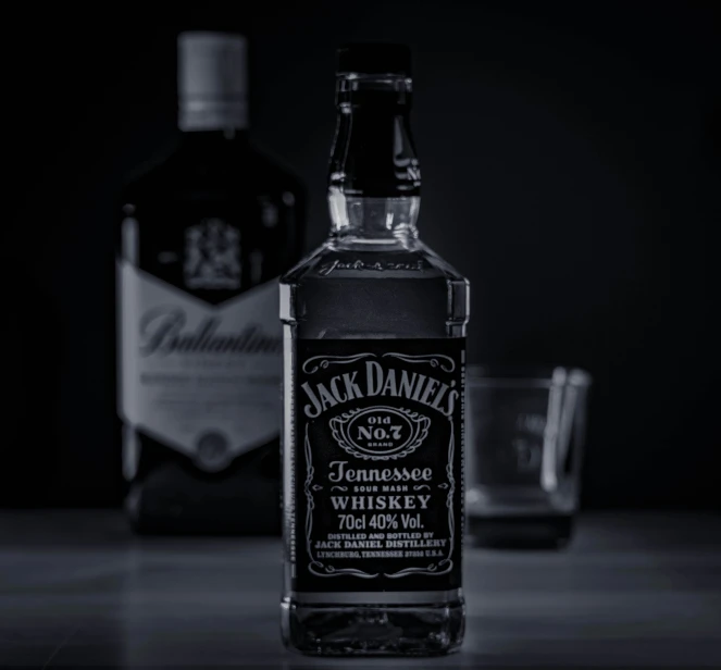 a bottle of jack daniels with the back to the camera
