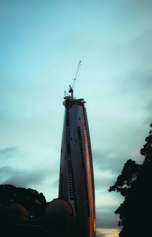 a building is lit up and has an antenna attached