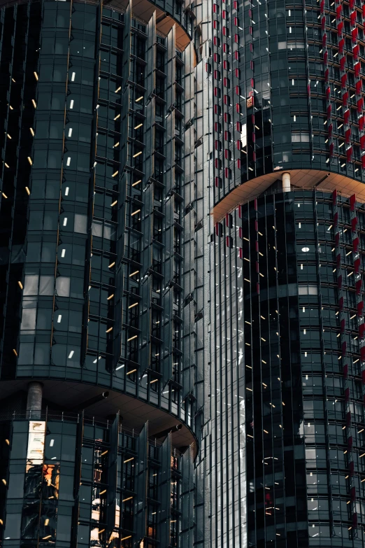 an upward view of the city skyline, with tall buildings and skyscrs