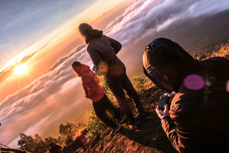 some people that are standing on a hill