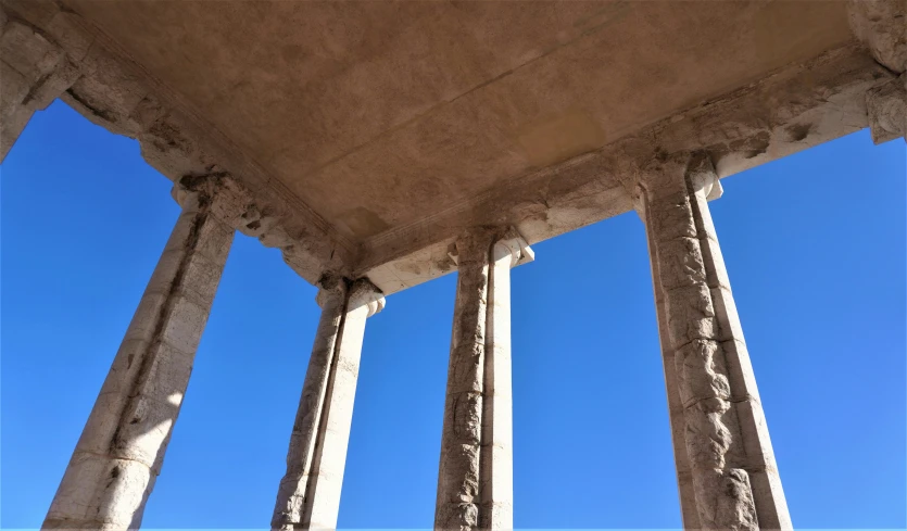 columns under a very clear blue sky on an island