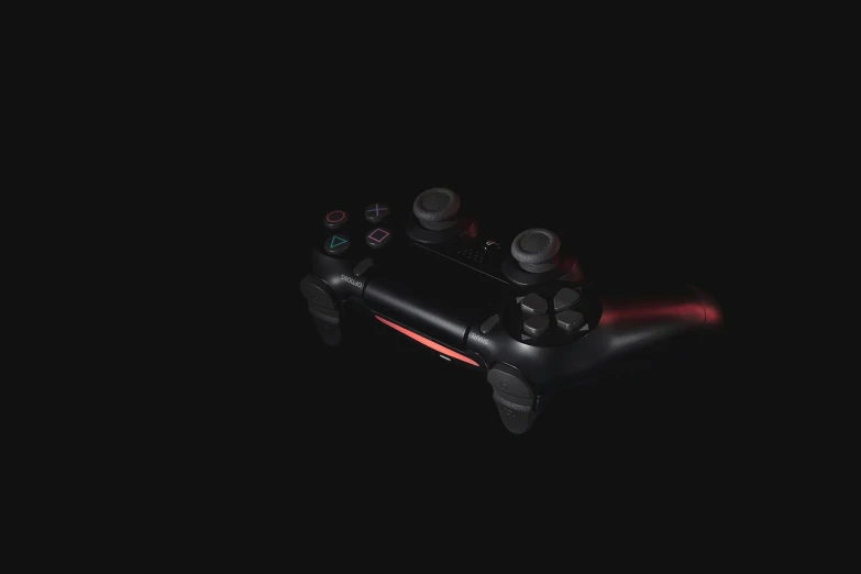 a video game controller in the dark with the light off