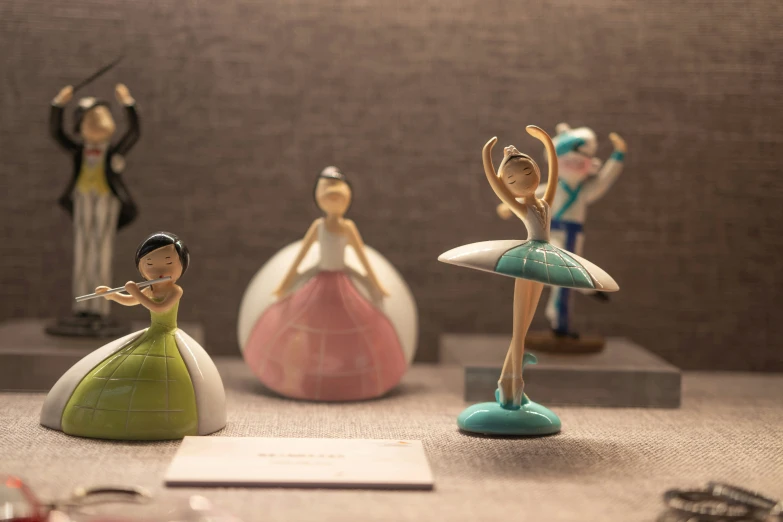 a group of figurines with women dressed up as ballet dancers