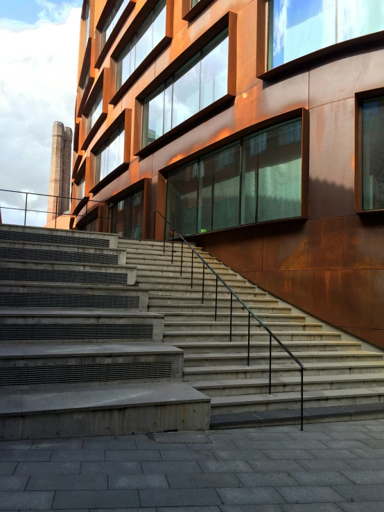 a brown building with some steps near by