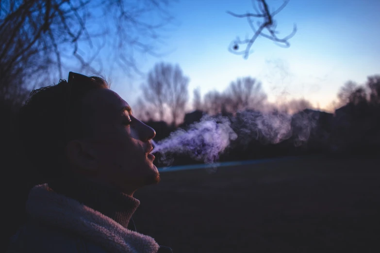 a man is looking away at soing and has smoke coming out of his ears