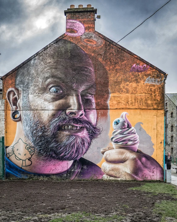 street art with man with purple eyeballs and a pink face