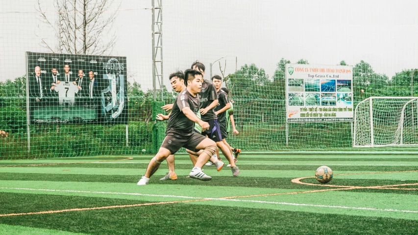 a group of men playing soccer on a field