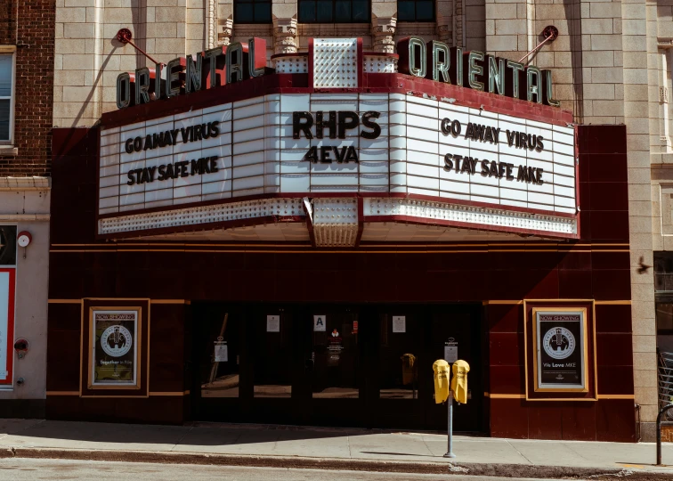 an old movie theater that says rrps sits at the front of it