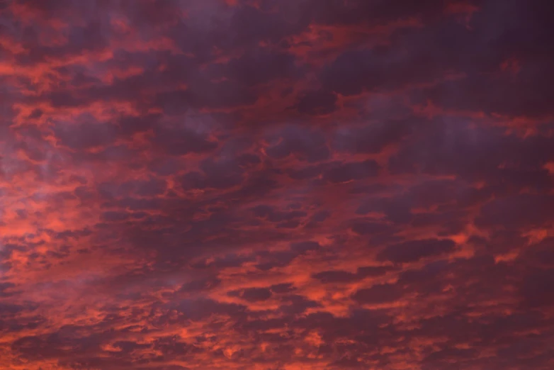 several large airplanes flying across a cloudy sky