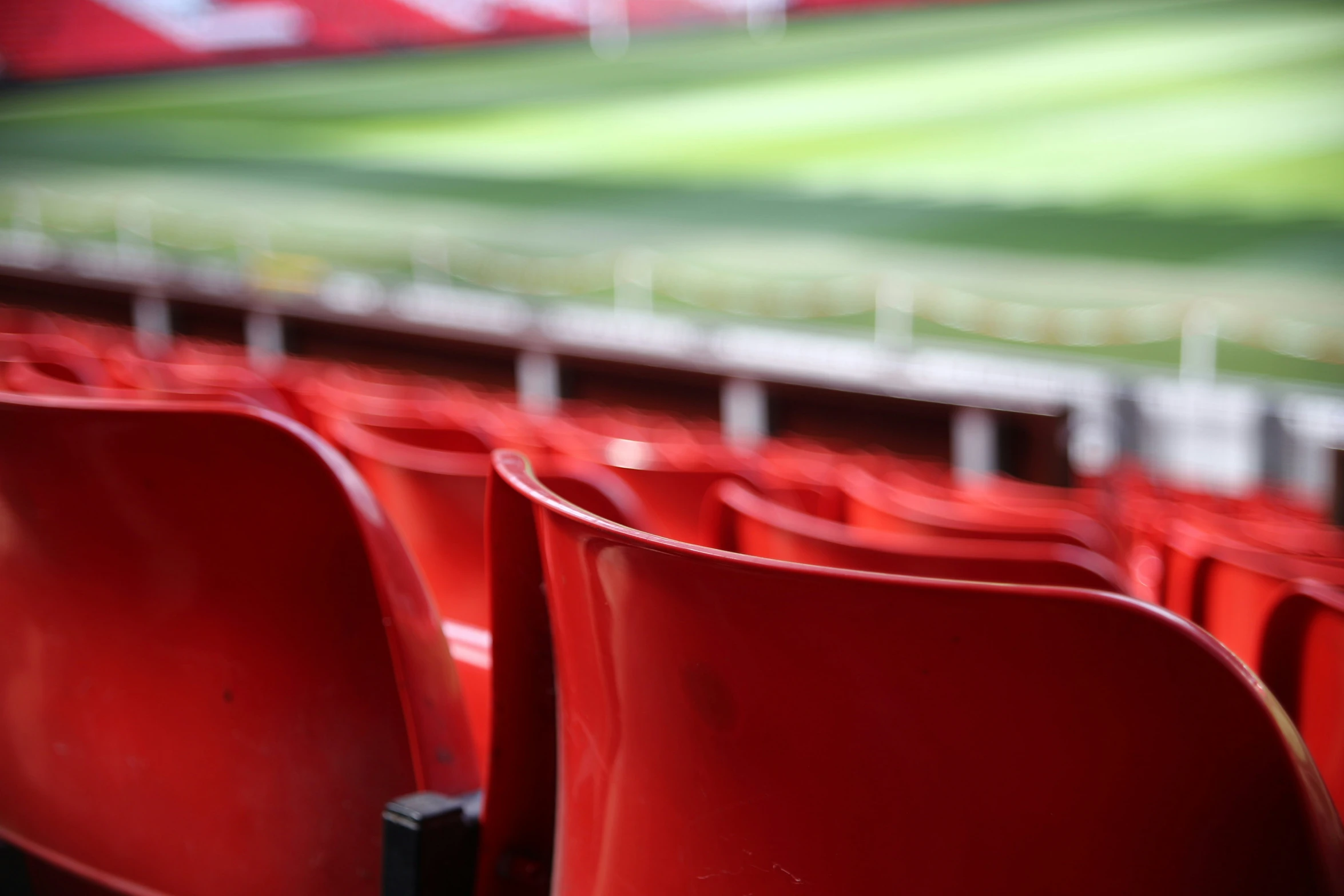 seats with red seats are sitting in the stadium