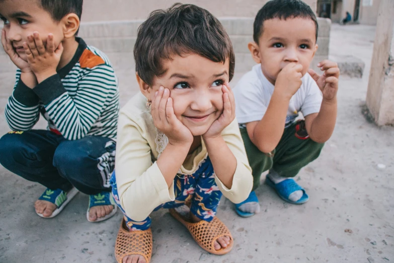 the small children are posing for a picture