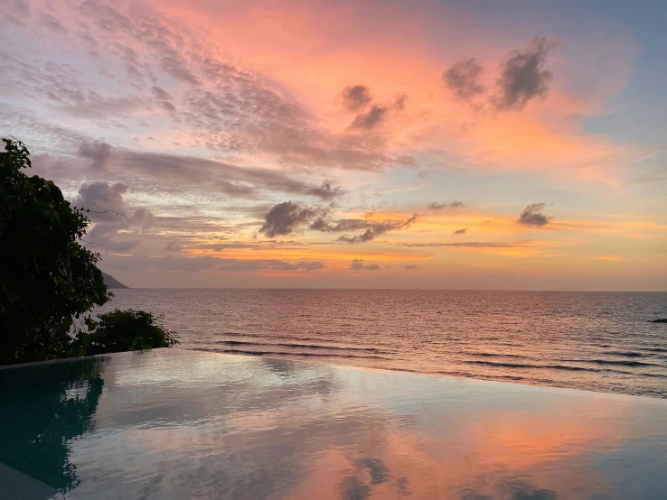 the view from the roof of an empty pool overlooking the water