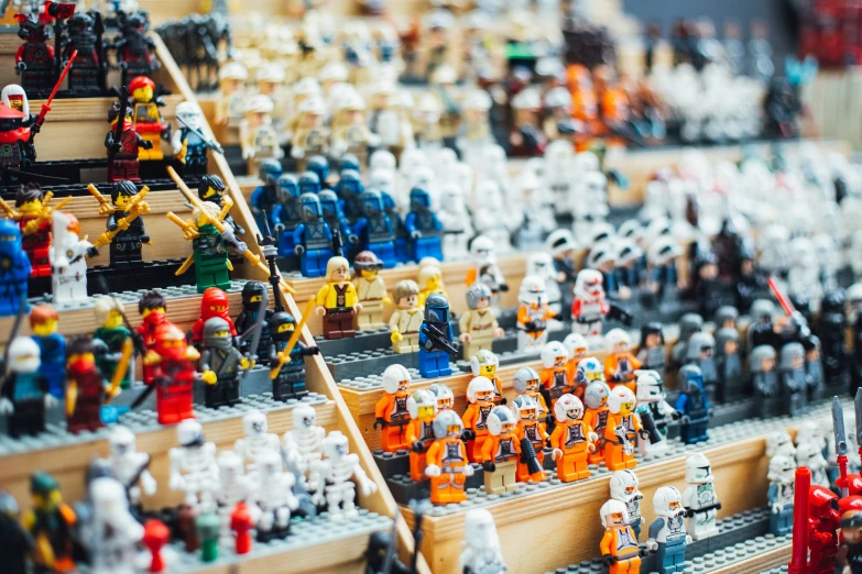 many lego figures displayed in an array