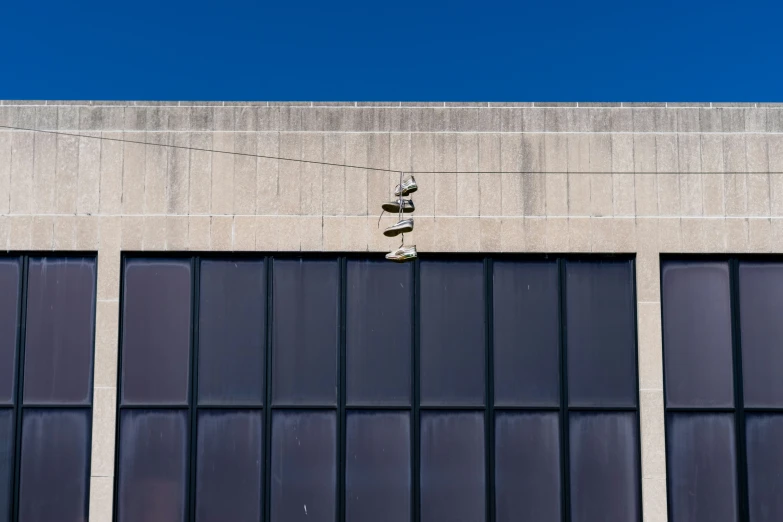 a stop sign is hanging off of a building