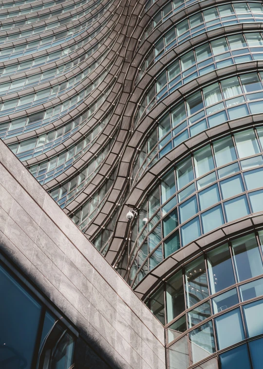 the side of an office building with multiple glass windows