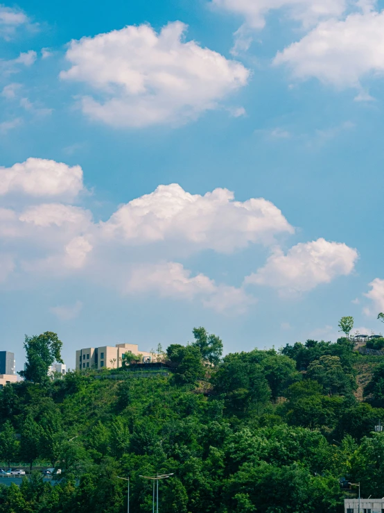 some buildings and clouds in the background