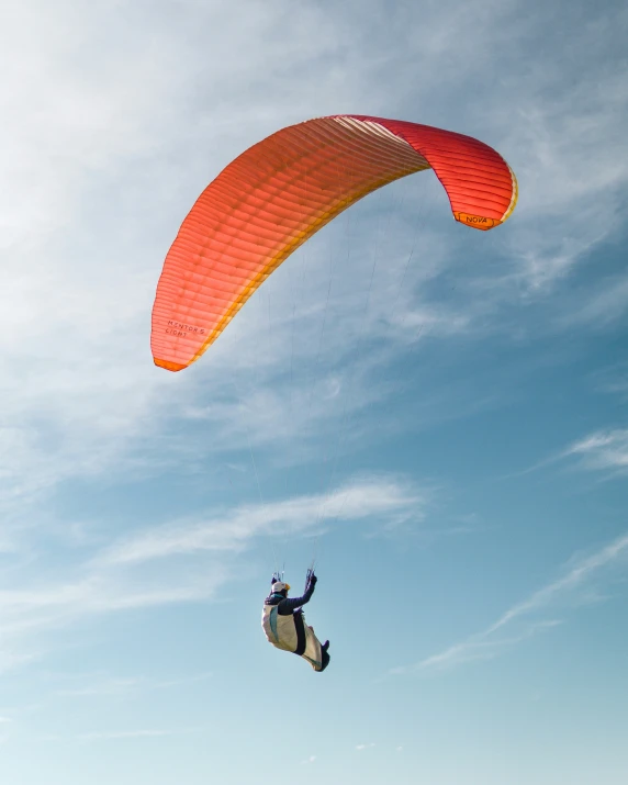 a person riding a kiteboard while the wind blows