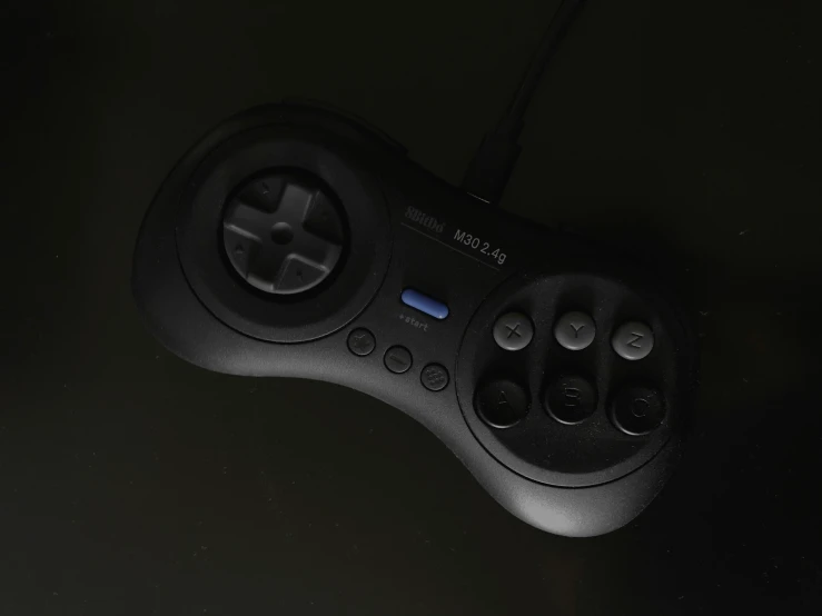 a close up of a game controller on a black background