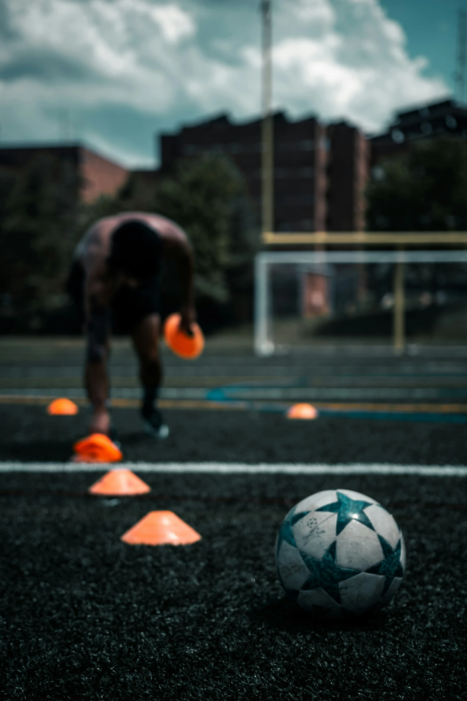 a person throwing balls towards an athletic ball