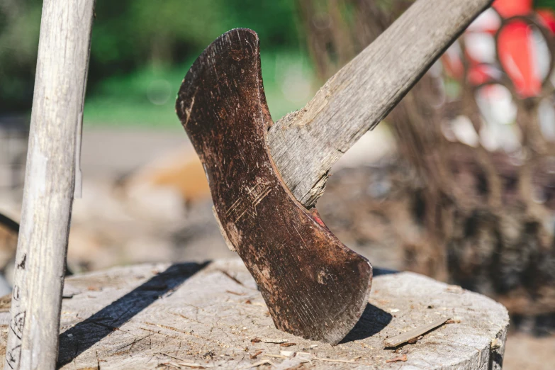 an old, worn, footed walking boot sitting on wood