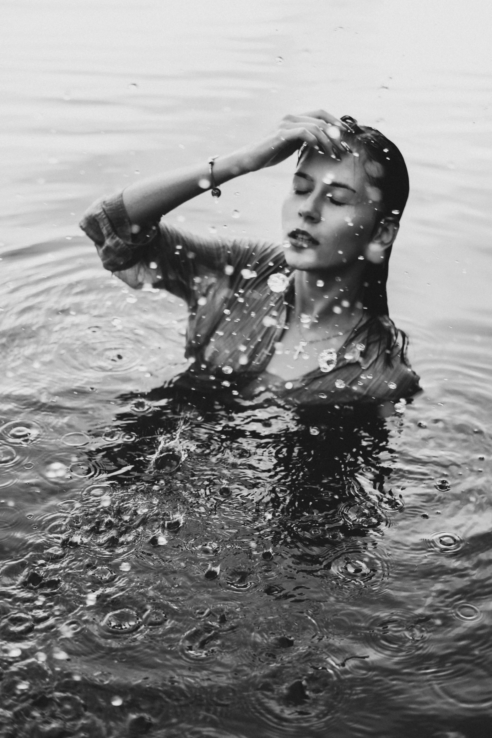 a black and white po of a woman swimming