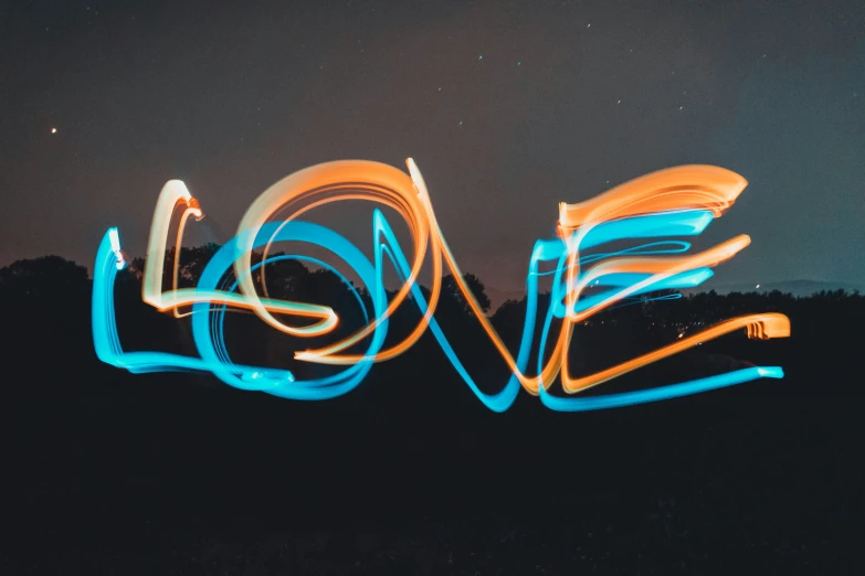 the word love spelled out of neon lights