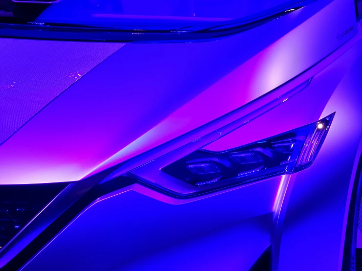 a car's interior with its lights on is purple and black