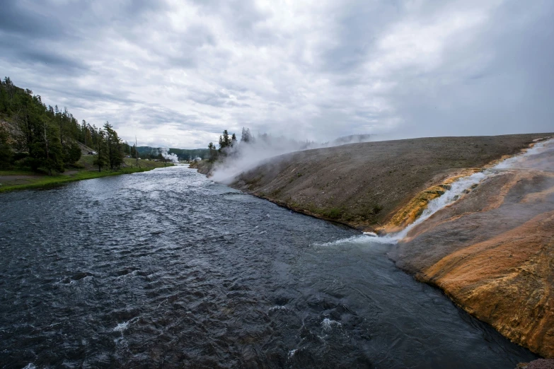 a stream flows across the dirt ground