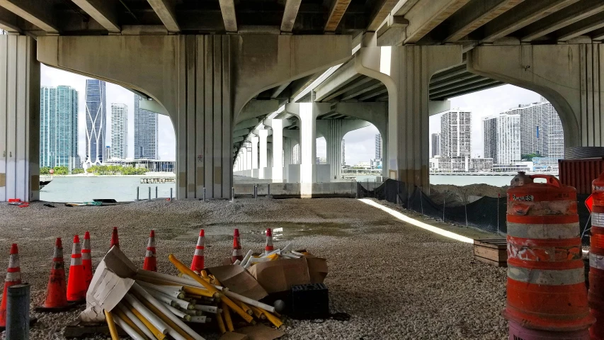 a road under construction with a few traffic cones