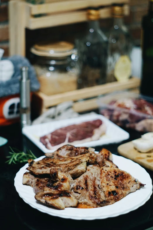 some cut up meat on a white plate