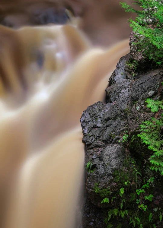 a waterfall is flowing down the stream