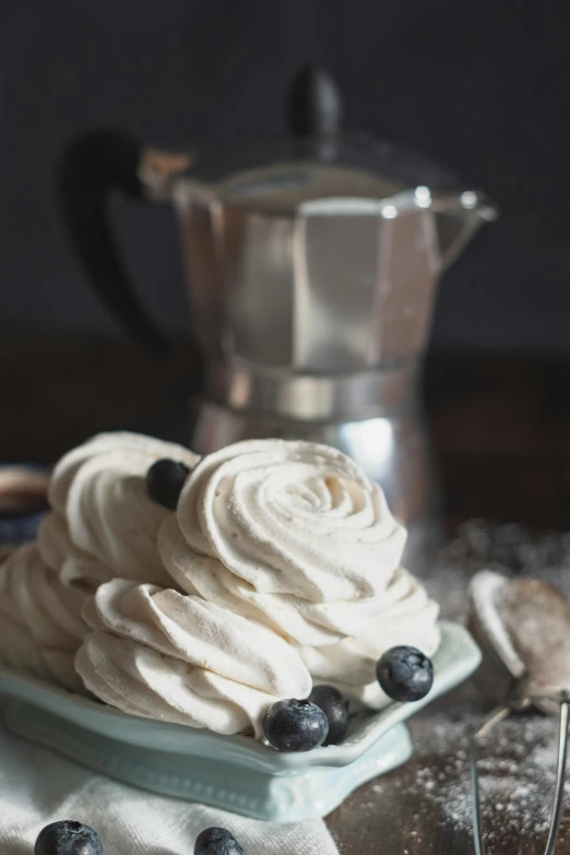 a bowl full of frosted mering sitting on top of a plate