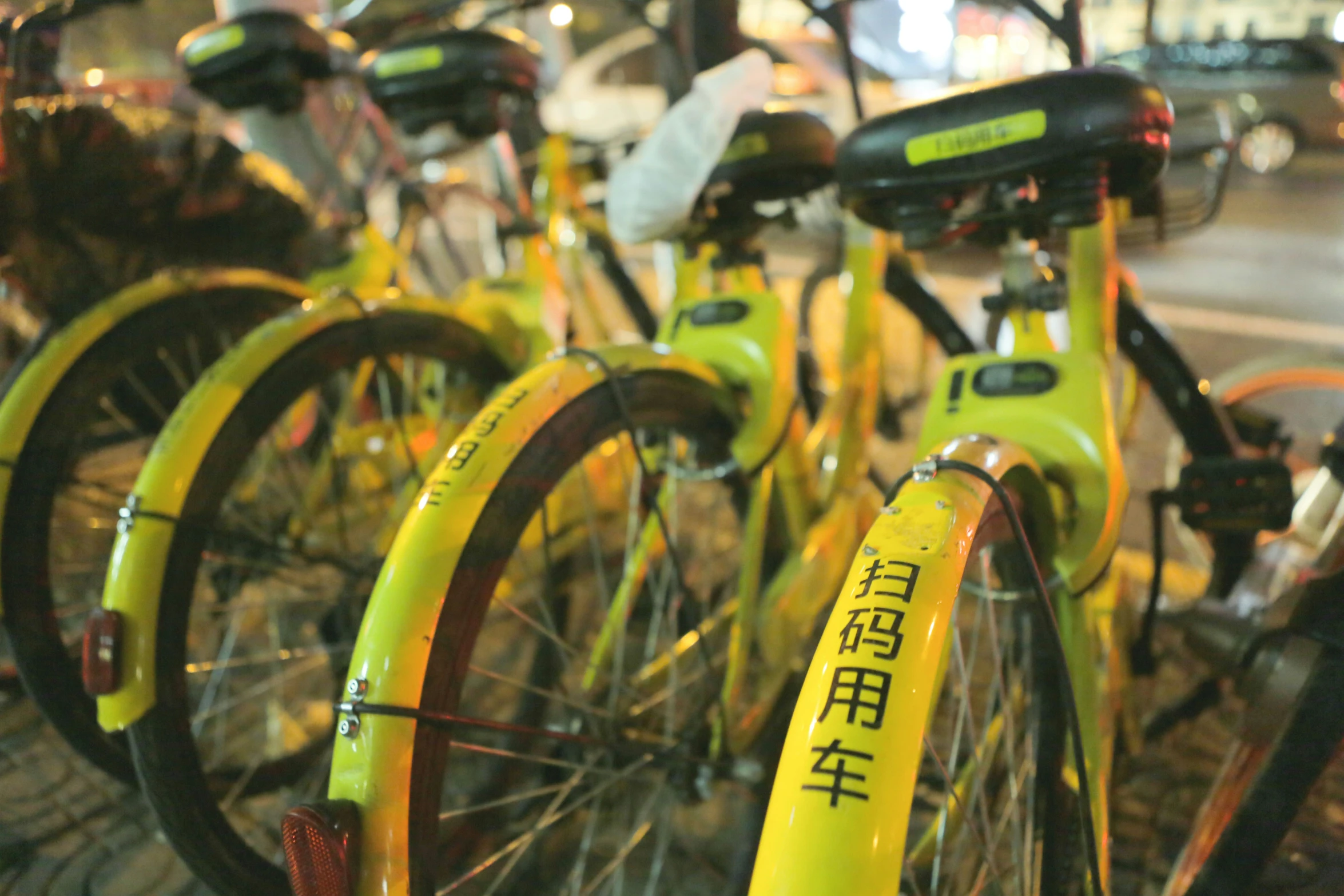 there are several bicycles parked along the street