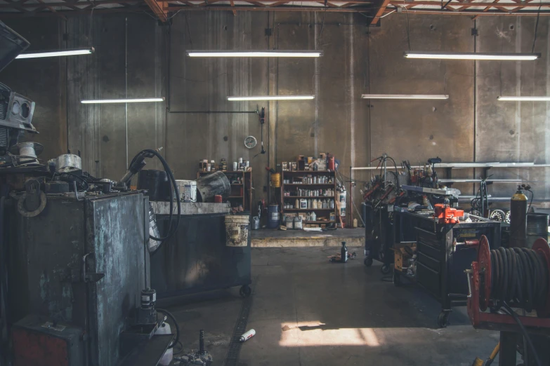 a room with various objects that include machines and pipes