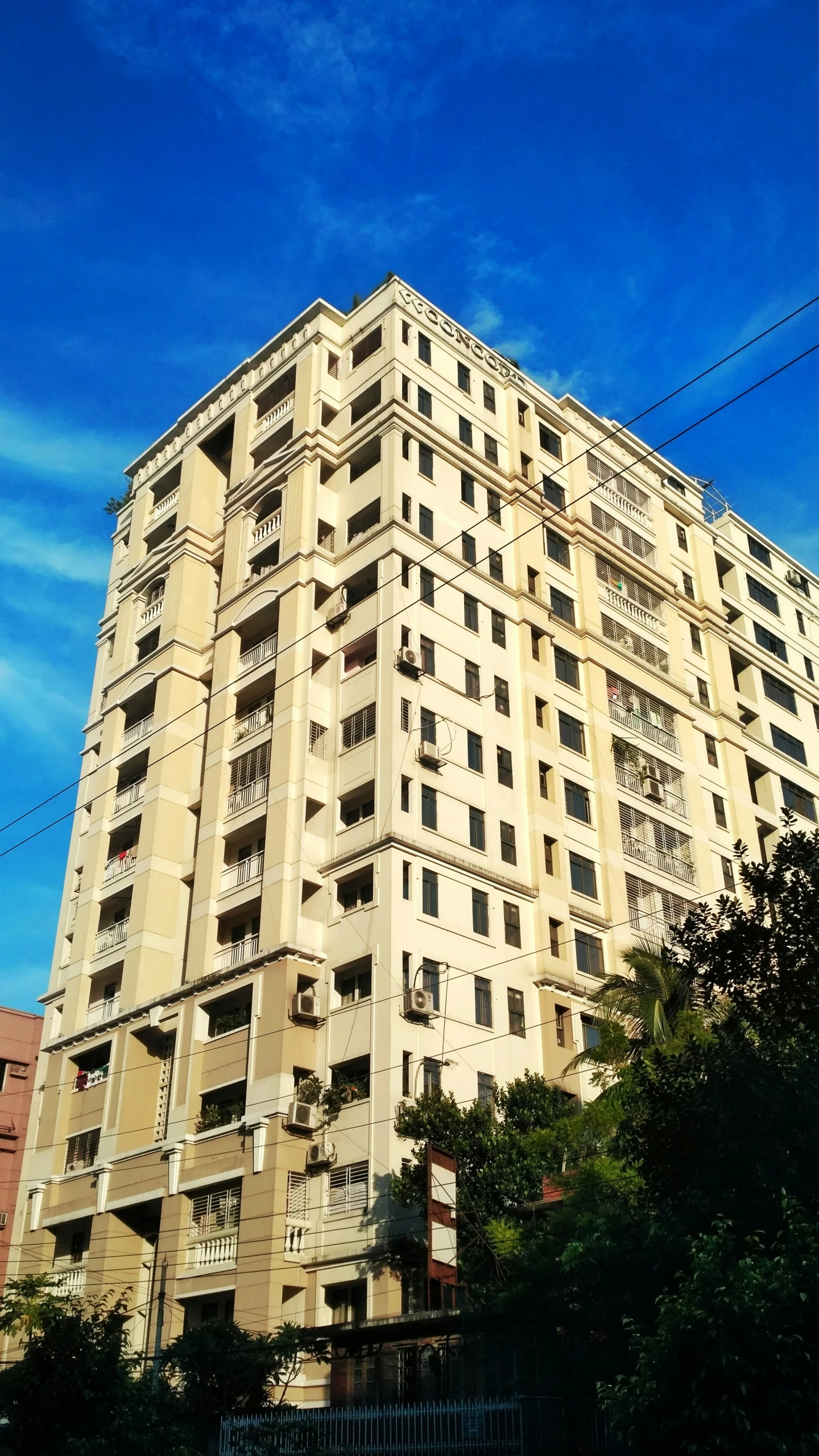 a tall building has balconies on the sides