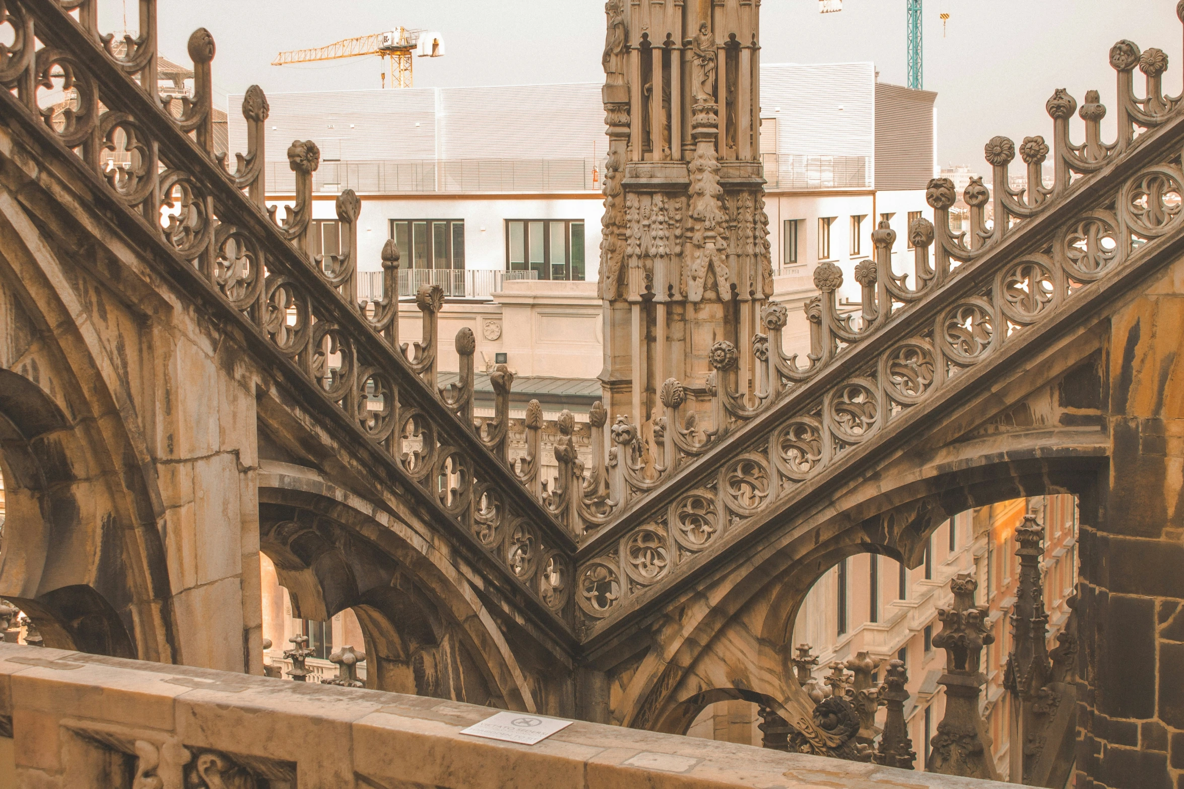 an old clock tower rises over a city in europe