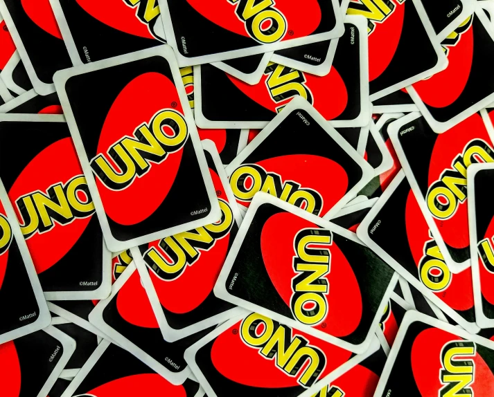 closeup of a pile of uno uno uno cards