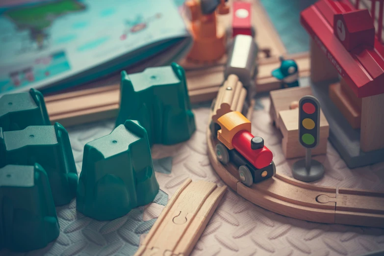 an assortment of small wooden toy train sets