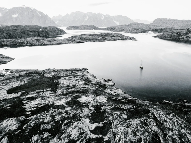 a person on a boat in the middle of a body of water