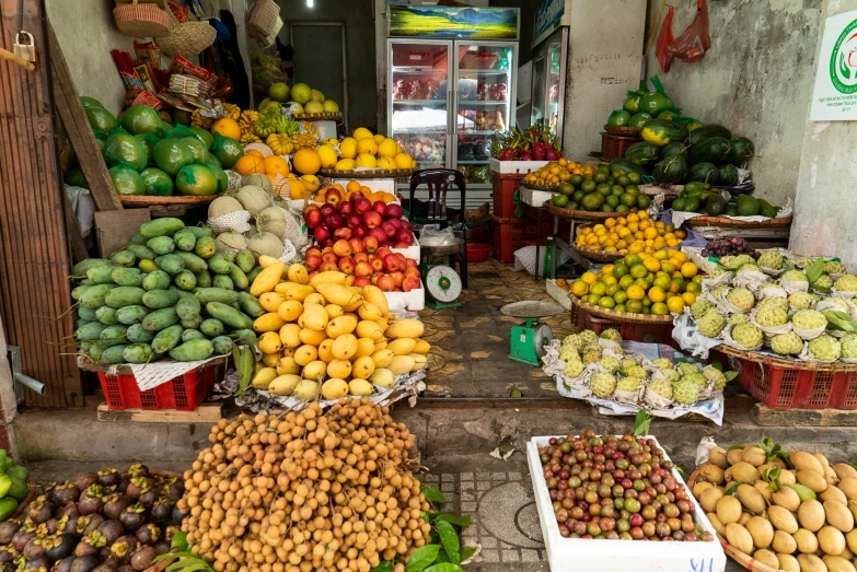 many different types of fruit and vegetables sitting out