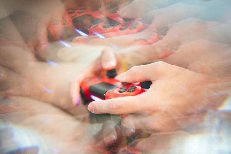 a blurry image of two hands operating a game controller