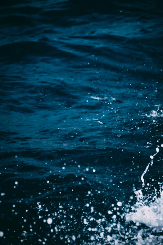 a surfer is riding his board in the water