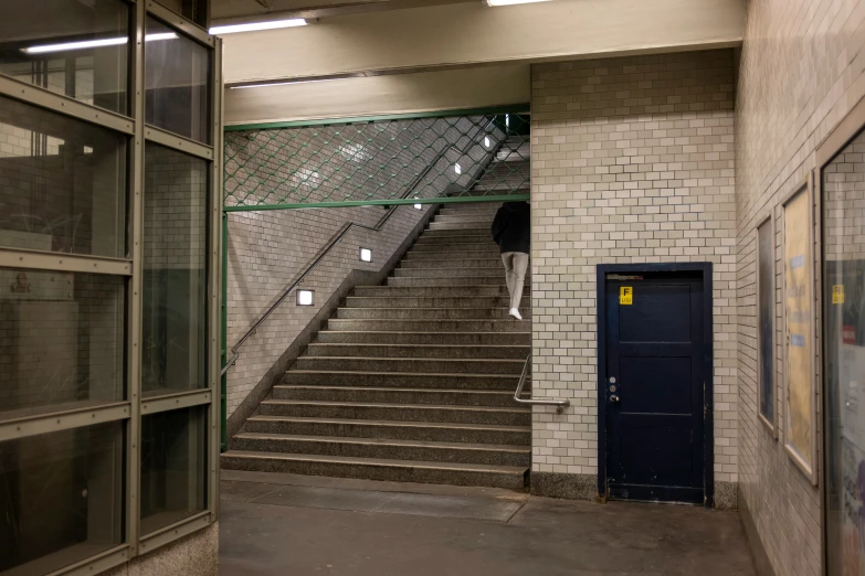 a staircase and two doors in an empty building