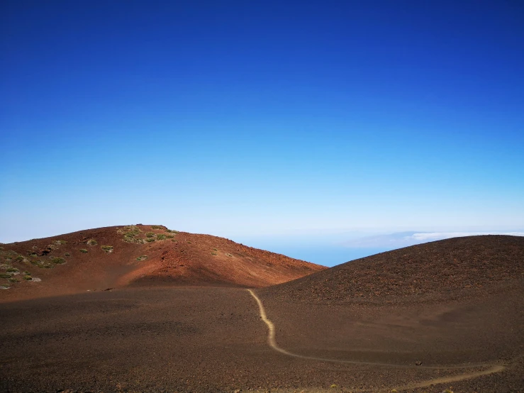 the mountains and the dirt are barren in contrast